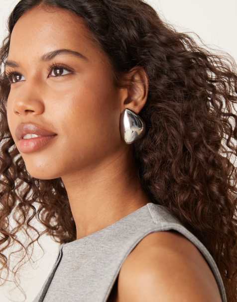 ASOS DESIGN large asymmetric stud earrings with domed shape in silver tone - view 1