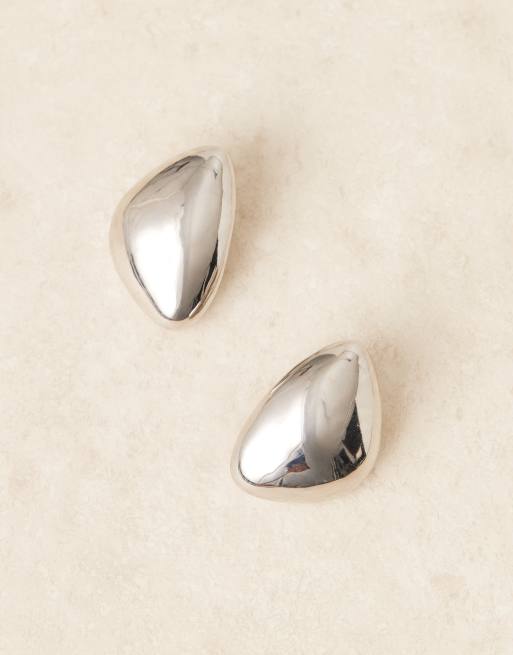 ASOS DESIGN large asymmetric stud earrings with domed shape in silver tone