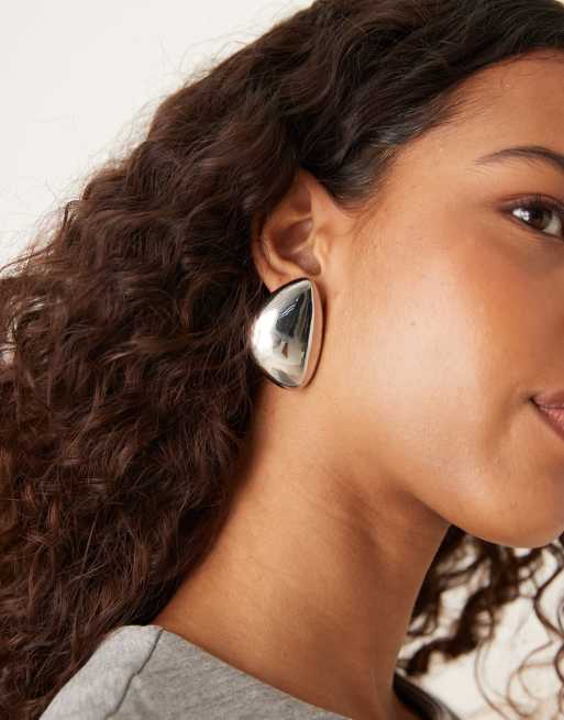 ASOS DESIGN large asymmetric stud earrings with domed shape in silver tone