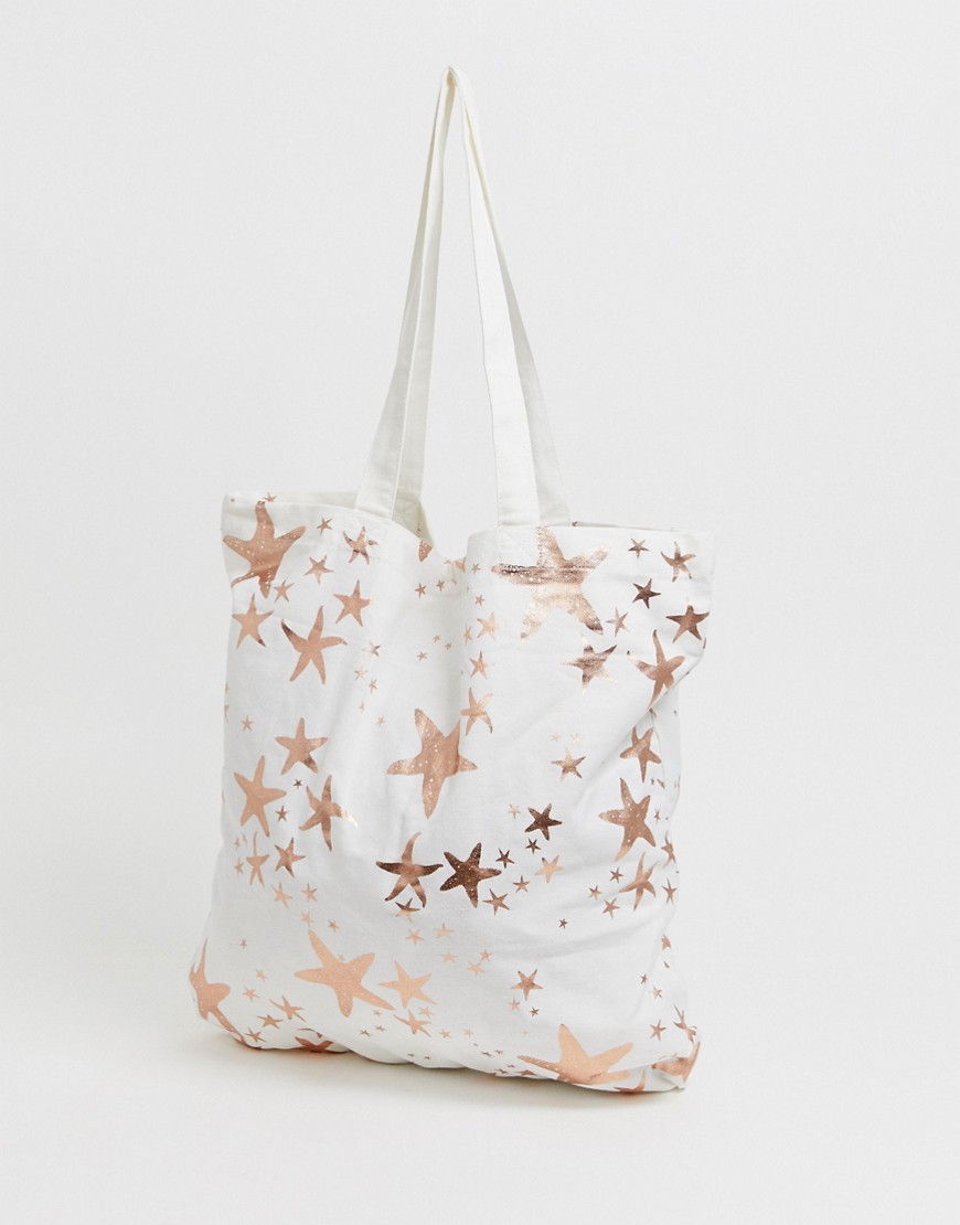 ASOS DESIGN large cotton beach tote bag in rose gold starfish print-Multi