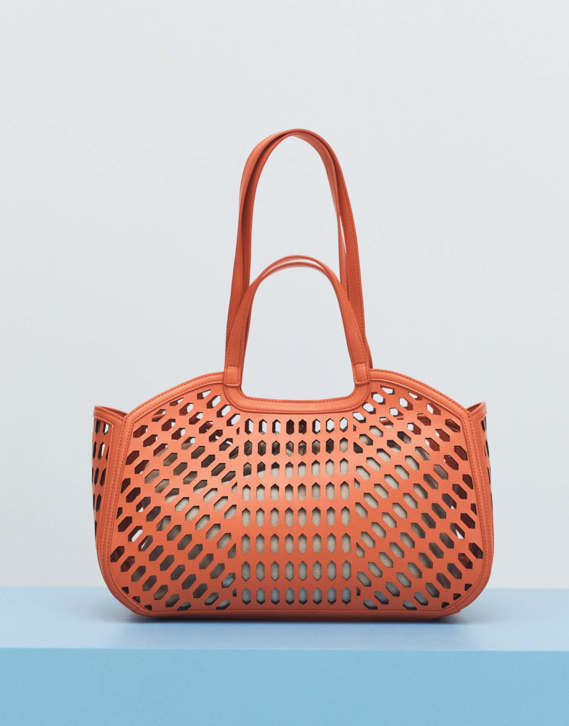 asos design laser cut tote bag in orange
