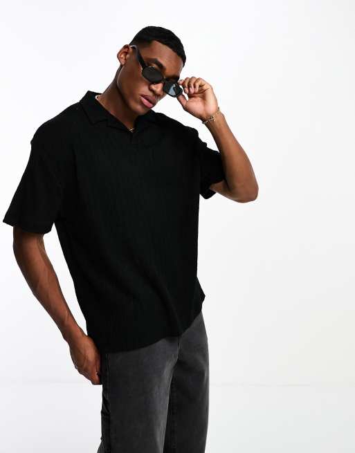 ASOS DESIGN – Lässig geschnittenes, geripptes Polohemd in strukturiertem Schwarz
