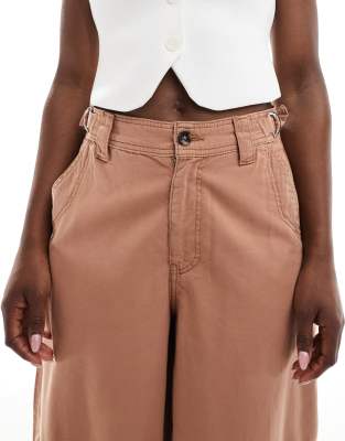 ASOS DESIGN laundered barrel leg pants with tab details in rust
