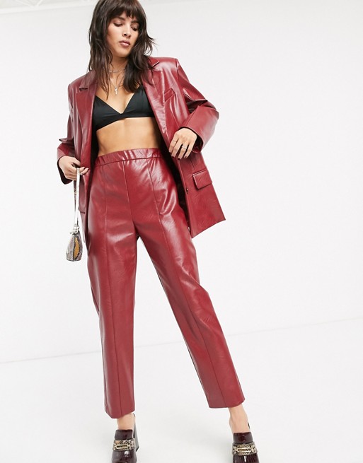ASOS DESIGN leather look suit trousers in red