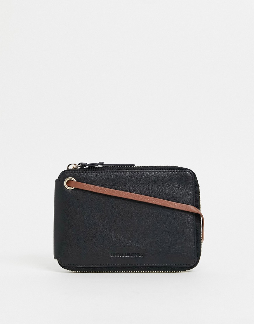 ASOS DESIGN leather travel wallet in black with contrast brown internals