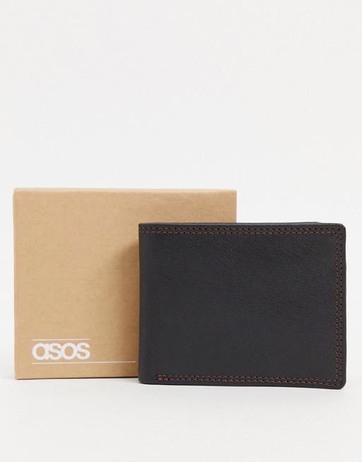 ASOS DESIGN leather wallet in black with burgundy contrast internals and stitch detail