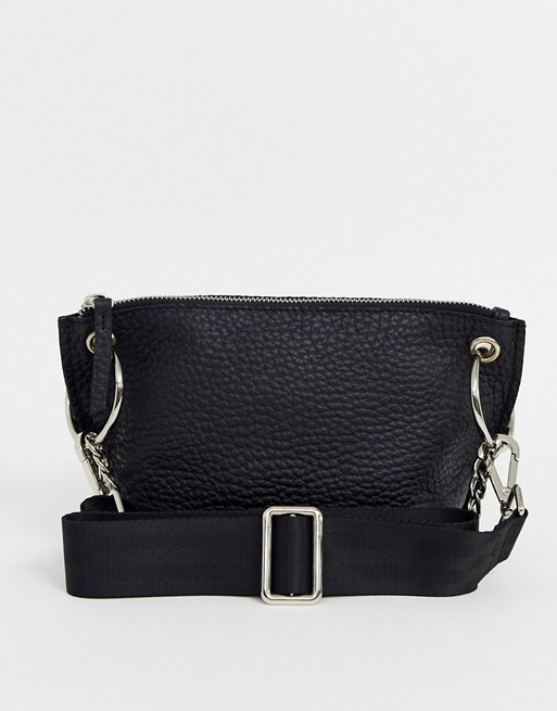 ASOS DESIGN LEATHER winged cross body bag with ring chain detail