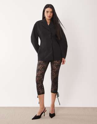 ASOS DESIGN - Leggings aus Spitze in Schwarz mit Schleifendetail