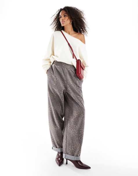 ASOS DESIGN – Leopardmönstrade byxor med uppvikt fåll i scubaliknande tyg - view 1