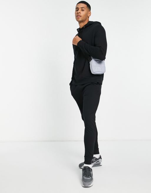 ASOS DESIGN - Lichtgewicht trainingspak met hoodie en skinny joggingbroek in zwart