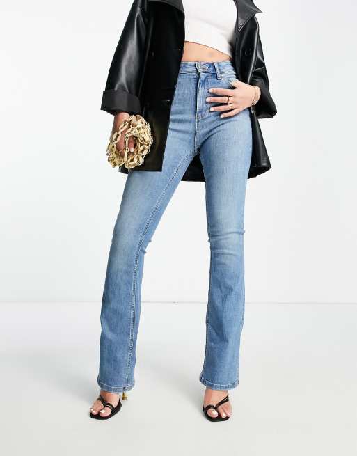 ASOS DESIGN Tall high rise 'lift and contour' stretch flare jeans in mid  blue