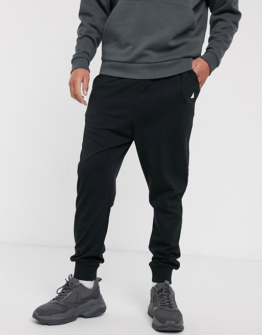 ASOS DESIGN lightweight drop crotch sweatpants in black with triangle ...