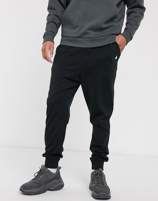 ASOS DESIGN lightweight drop crotch sweatpants in black with triangle | ASOS