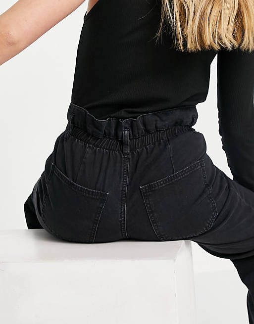 Women lightweight paperbag waist jeans in washed black 