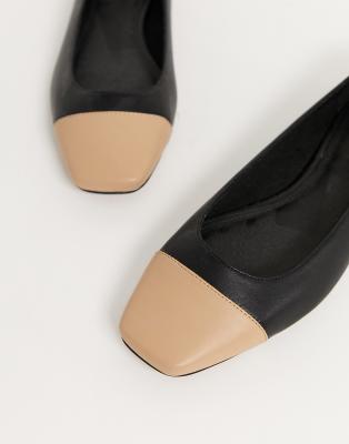 tan and black cap toe flats