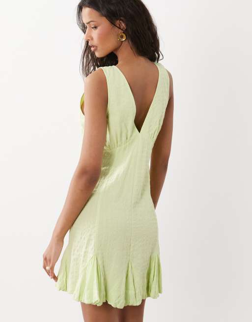 ASOS DESIGN - Limegrøn forvasket minikjole med V-hals og knapper, samt blondekanter og kiler, 4 af 4