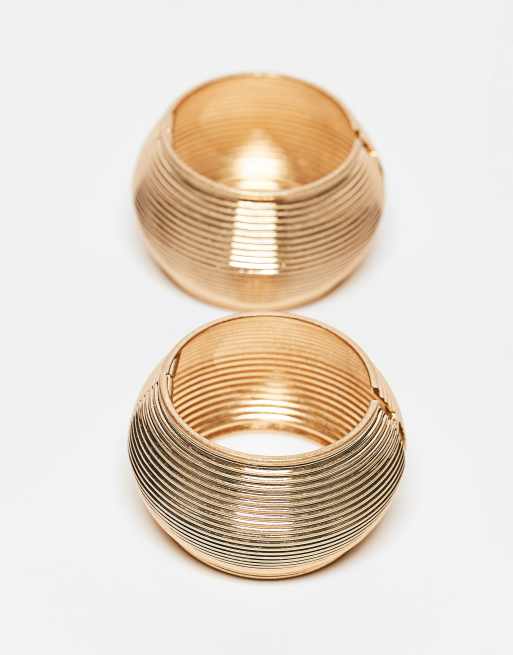 ASOS DESIGN - Limited Edition - Set van 2 bangle armbanden met ribbeldetail in goudkleur