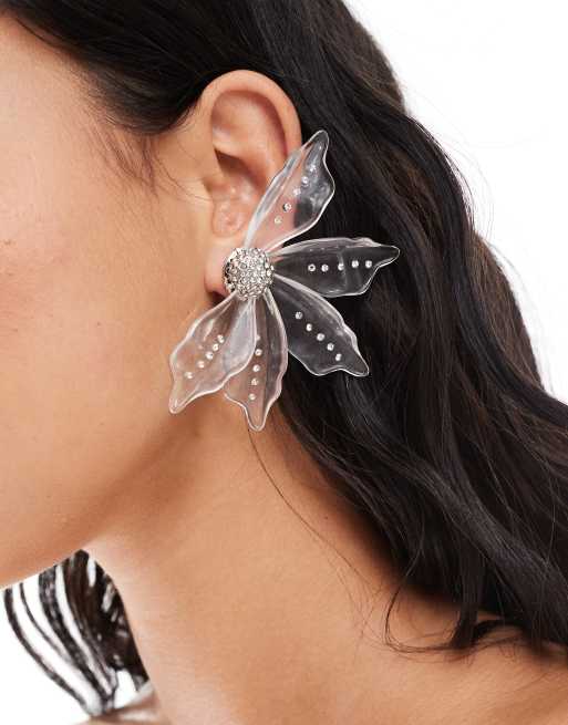 ASOS DESIGN Limited Edition stud earrings with clear resin and crystal floral detail in silver tone ASOS