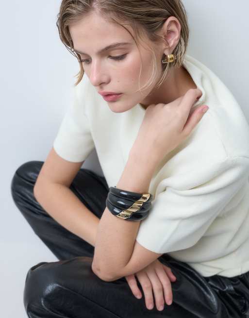 ASOS DESIGN Limited Edition XL abstract clasp bangle in black resin with gold detailing, 2 of 4