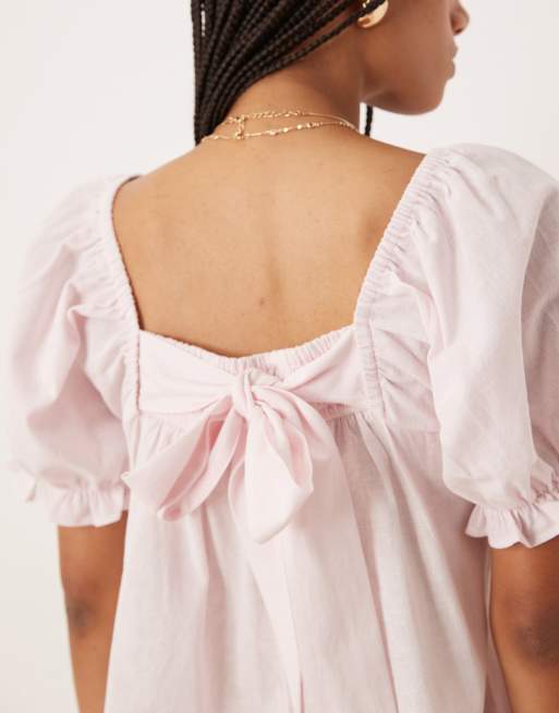 ASOS DESIGN linen babydoll puff sleeve playsuit with bow back detail in powder pink, 2 of 4