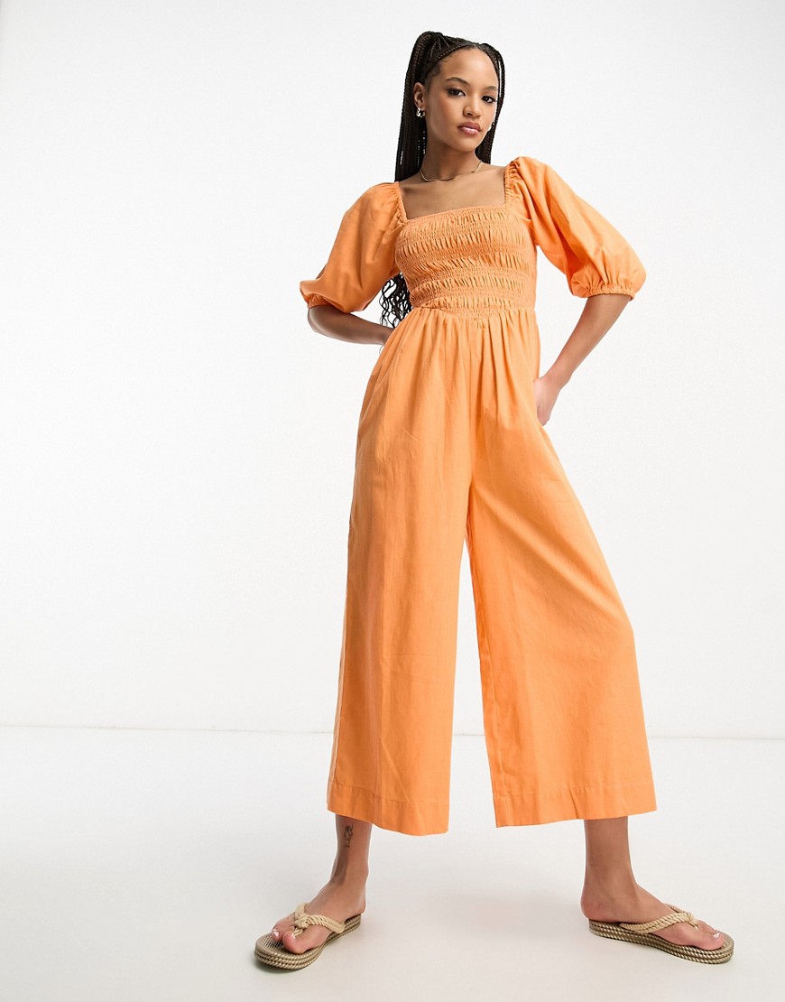 Shop Asos Design Linen Look Shirred Puff Sleeve Jumpsuit In Orange