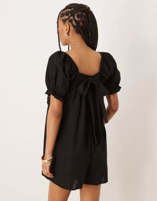 Asos Design Linen Mix Babydoll Puff Sleeve Romper With Bow Back Detail In Black