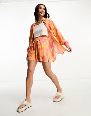 Relaxed Linen Shirt With Dip Hem In Orange And Pink Floral Print