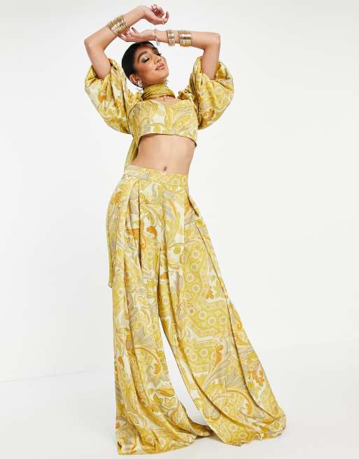 ASOS DESIGN - L'invitée - Pantalon palazzo large plissé sur le devant à imprimé feuilles - Jaune