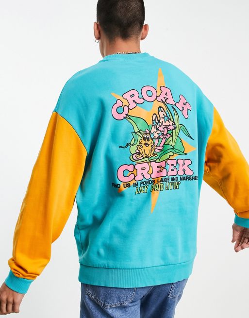 ASOS DESIGN – Ljus blockfärgad sweatshirt i oversize med grodtryck baktill