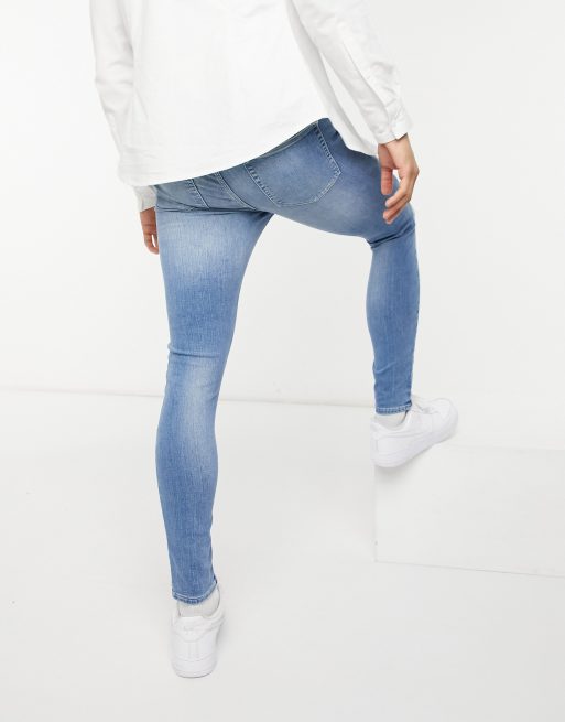 ASOS DESIGN – Ljusa, extra stretchiga jeans i spray on-passform, 2 av 4