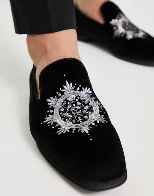 Black store embroidered loafers