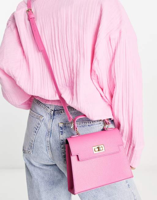 ASOS DESIGN lock detail bag with top handle and detachable crossbody strap in pink