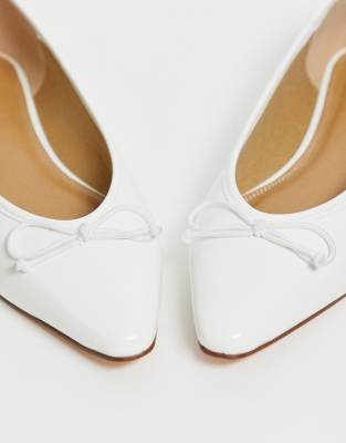 white pointed flats