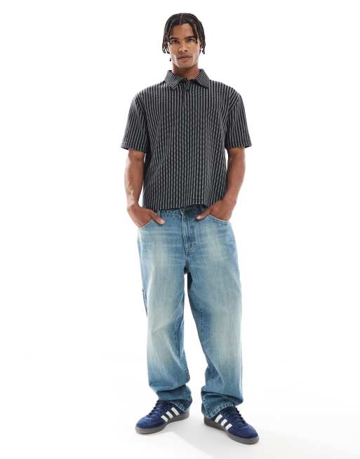 ASOS DESIGN – Locker geschnitenes, kastiges Poloshirt mit Streifen in Schwarz und Weiß, 2 von 4