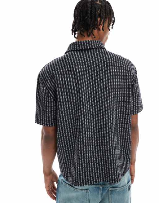 ASOS DESIGN – Locker geschnitenes, kastiges Poloshirt mit Streifen in Schwarz und Weiß, 4 von 4