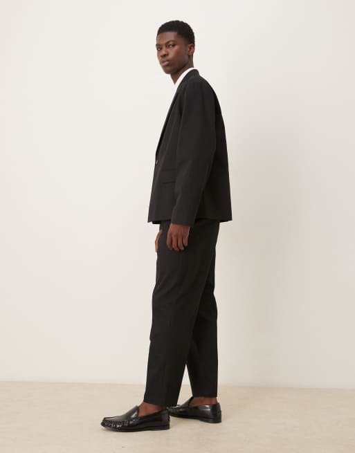 ASOS DESIGN – Locker geschnittene, schmal zulaufende Anzughose aus Baumwolle in Schwarz, 3 von 5