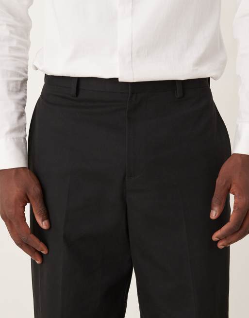 ASOS DESIGN – Locker geschnittene, schmal zulaufende Anzughose aus Baumwolle in Schwarz, 4 von 5