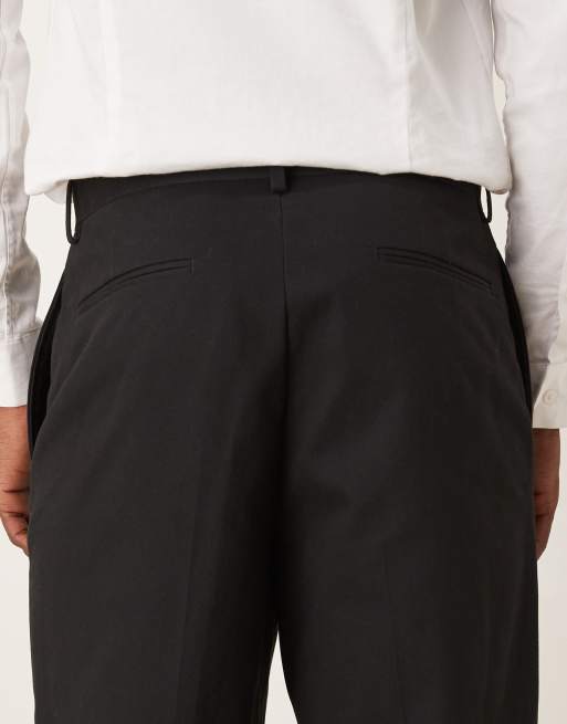 ASOS DESIGN – Locker geschnittene, schmal zulaufende Anzughose aus Baumwolle in Schwarz, 5 von 5