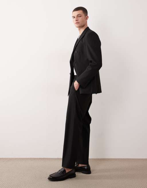 ASOS DESIGN – Locker geschnittene, schmal zulaufende Anzughose aus Twill in Schwarz, 2 von 5