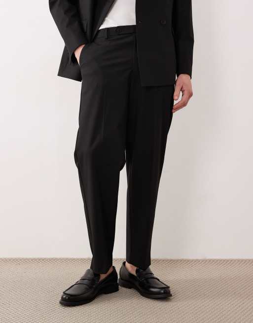 ASOS DESIGN – Locker geschnittene, schmal zulaufende Anzughose aus Twill in Schwarz, 3 von 5