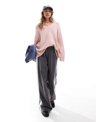 ASOS Design - Locker gestrickter Oversize-Pullover in Rosa mit V-Ausschnitt