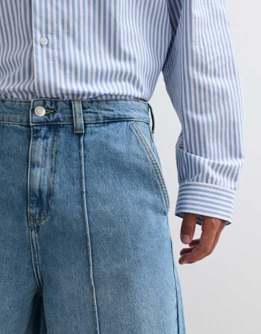 ASOS DESIGN lockere Jorts in längerer Länge in mittlerer blauer Waschung mit Bügelfalte, 2 von 5