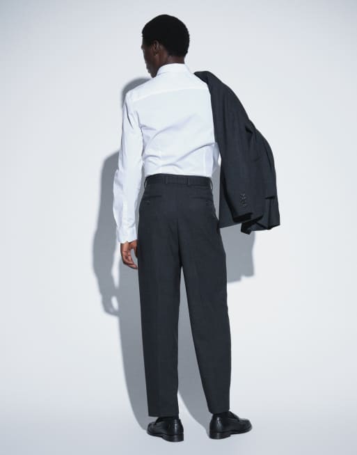 ASOS DESIGN lockere, schmal zulaufende Anzughose in Schwarz mit Hahnentrittmuster, 3 von 5