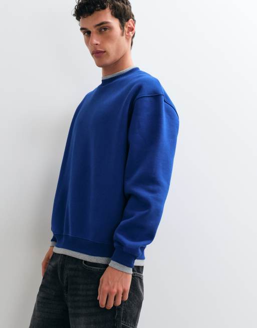 ASOS DESIGN lockeres Sweatshirt mit Rundhalsausschnitt und angesetzten Rippen in Blau aus Poly-Baumwolle, 4 von 5