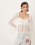 [ASOS DESIGN] ASOS DESIGN long flared sleeve peplum hem top in cream-White 14 Cream