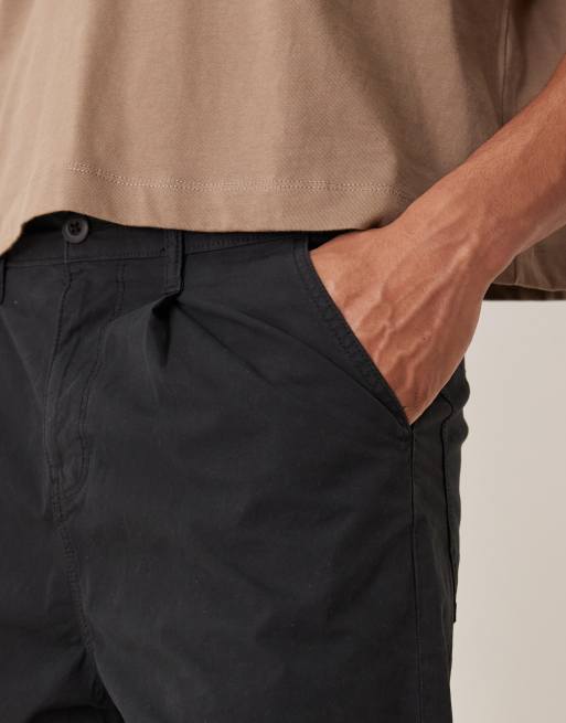 ASOS DESIGN long length pleated shorts in black