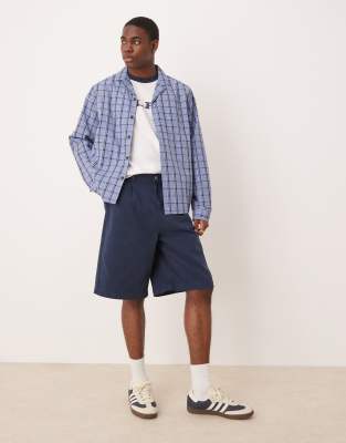 ASOS DESIGN long length pleated shorts in navy
