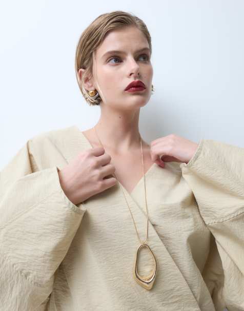 ASOS DESIGN long necklace with abstract pendant in gold tone - view 1