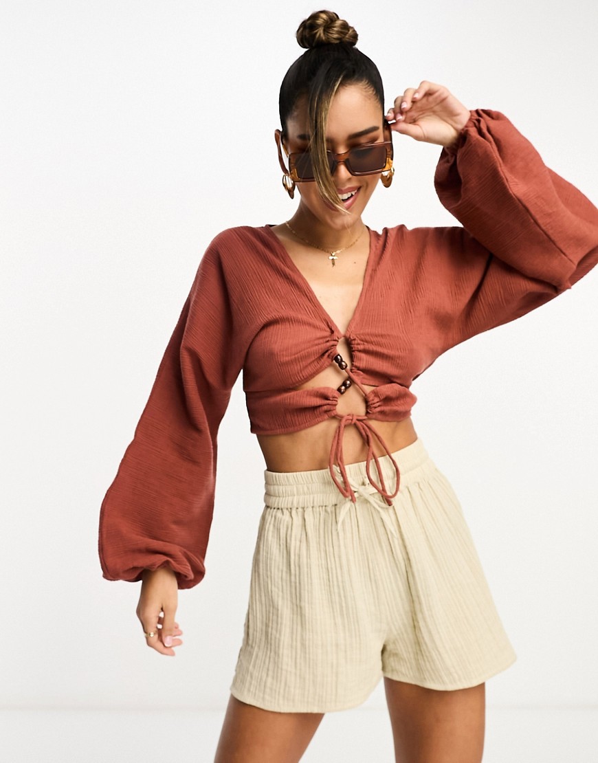 ASOS DESIGN long sleeve crinkle top with lace up lattice detail in rust-Copper