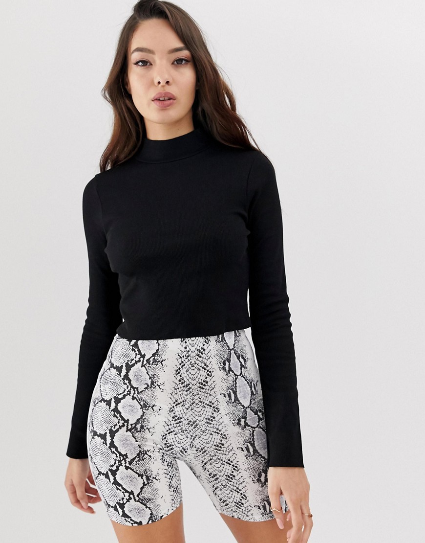 ASOS DESIGN long sleeve crop top with turtle neck and raw hem in rib in black